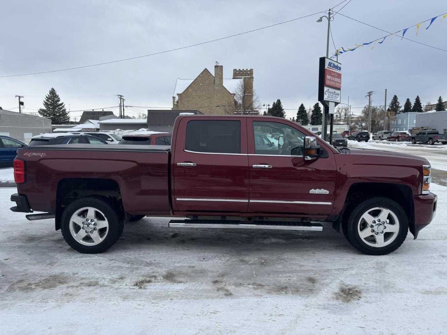 2015 Maroon /Brown Chevrolet Silverado 2500HD High Country (1GC1KXEG8FF) with an 6.0L engine, Automatic transmission, located at 116 5th Avenue South, Lewistown, MT, 59457, 47.063877, -109.427879 - Looking for a powerful and luxurious truck that can handle any job? This 2015 Chevrolet Silverado 2500HD Crew Cab High Country with a 6.0L gas engine is the perfect choice. In excellent condition, this truck is ready to meet all your work and play needs. The 2015 Chevrolet Silverado 2500HD High C - Photo#1