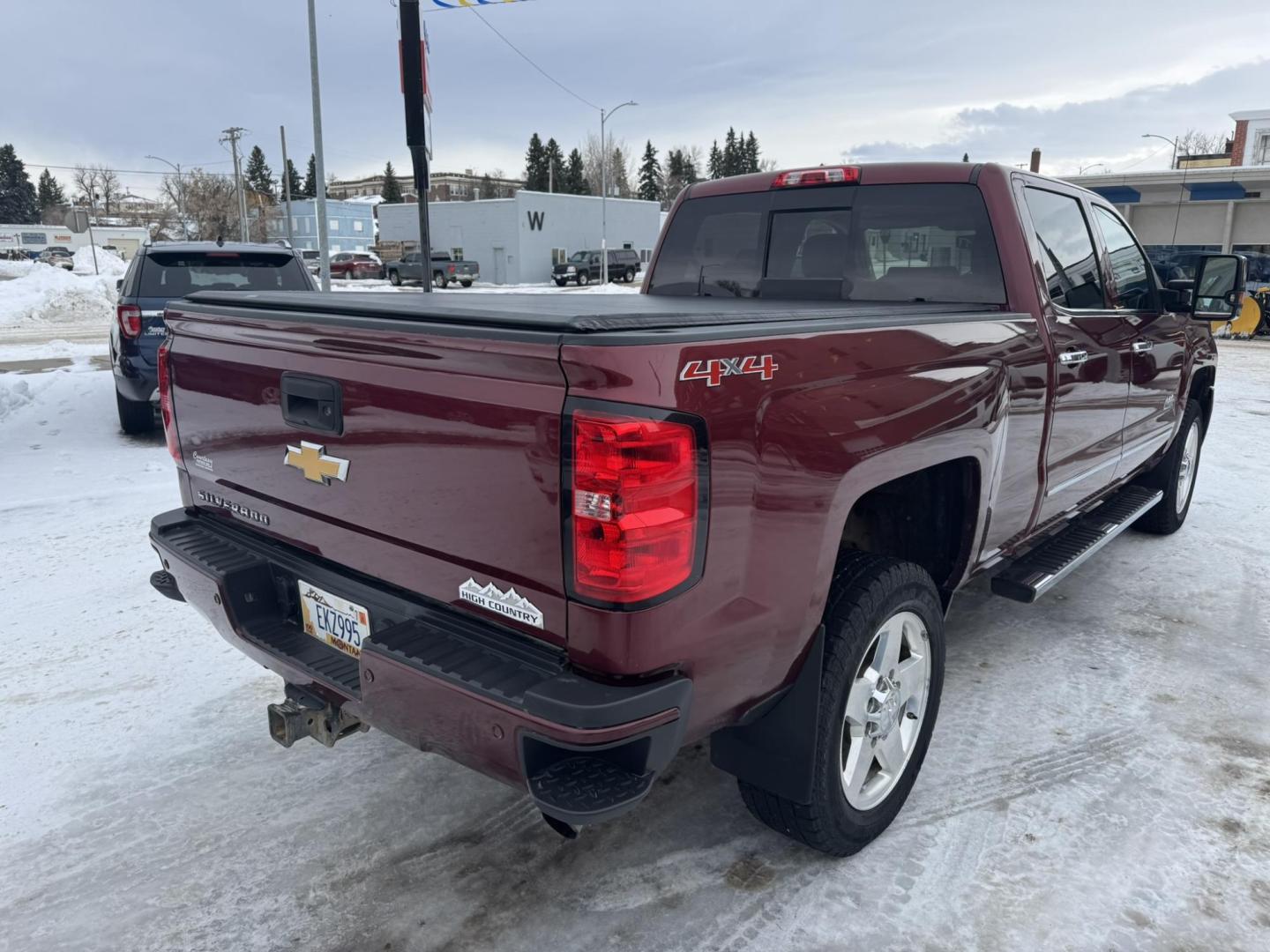 2015 Maroon /Brown Chevrolet Silverado 2500HD High Country (1GC1KXEG8FF) with an 6.0L engine, Automatic transmission, located at 116 5th Avenue South, Lewistown, MT, 59457, 47.063877, -109.427879 - Looking for a powerful and luxurious truck that can handle any job? This 2015 Chevrolet Silverado 2500HD Crew Cab High Country with a 6.0L gas engine is the perfect choice. In excellent condition, this truck is ready to meet all your work and play needs. The 2015 Chevrolet Silverado 2500HD High C - Photo#2