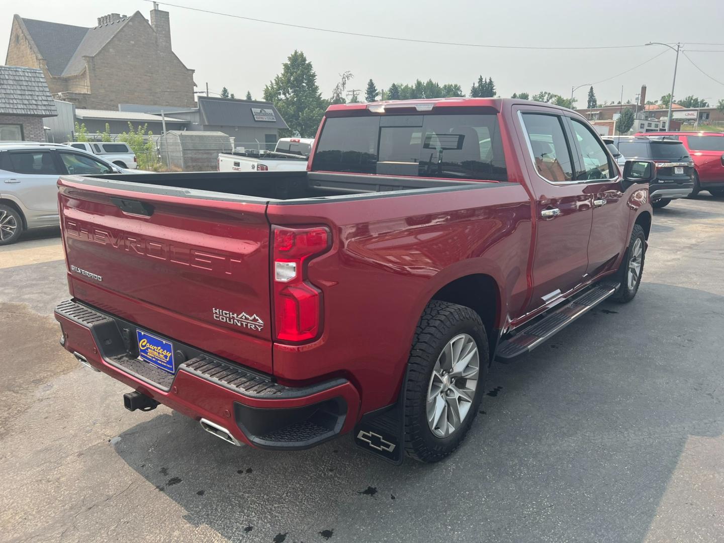 2021 Maroon /Black Chevrolet Silverado 1500 High Country (1GCUYHELXMZ) with an 6.2L DI V8 engine, Automatic transmission, located at 116 5th Avenue South, Lewistown, MT, 59457, 47.063877, -109.427879 - Discover the luxury and power of the 2021 Chevrolet Silverado 1500 Crew Cab High Country 4WD. This exceptional truck combines sophisticated design with robust performance, featuring: Luxurious leather-appointed interior with heated and ventilated front seats Advanced 4WD system for superior trac - Photo#3