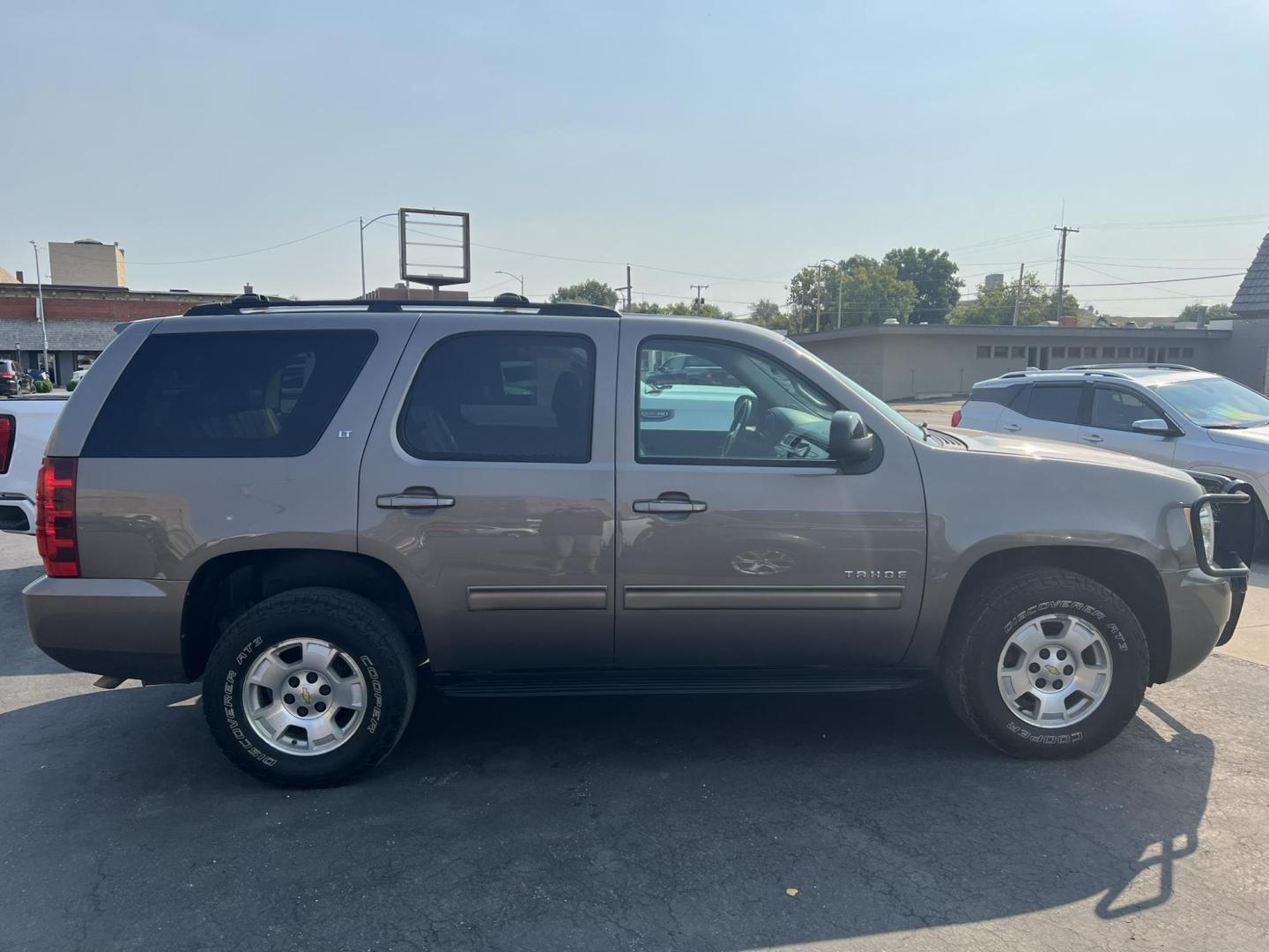 2014 /Charcoal Chevrolet Tahoe LT 4WD (1GNSKBE02ER) with an 5.3L V8 OHV 16V FFV engine, 6-Speed Automatic transmission, located at 116 5th Avenue South, Lewistown, MT, 59457, 47.063877, -109.427879 - Super clean and straight 2014 Chevrolet Tahoe LT. Heated leather and more in this local well maintained trade! - Photo#0