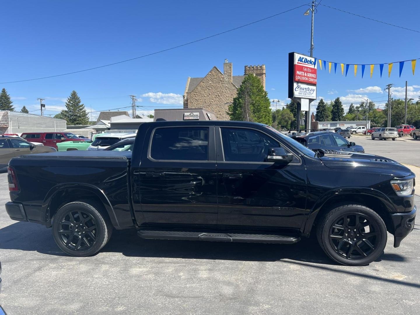 2021 Black /Black RAM 1500 Laramie Crew Cab SWB 4WD (1C6SRFJT8MN) with an 5.7L V8 OHV 16V engine, 8A transmission, located at 116 5th Avenue South, Lewistown, MT, 59457, 47.063877, -109.427879 - 2021 Ram 1500 Laramie Crew Cab 4WD, powered by a robust 5.7L HEMI engine. This truck combines luxury with rugged capability, offering premium leather seating, advanced technology features, and superior towing capacity. The spacious crew cab ensures comfort for all passengers, while the 4WD system gi - Photo#1