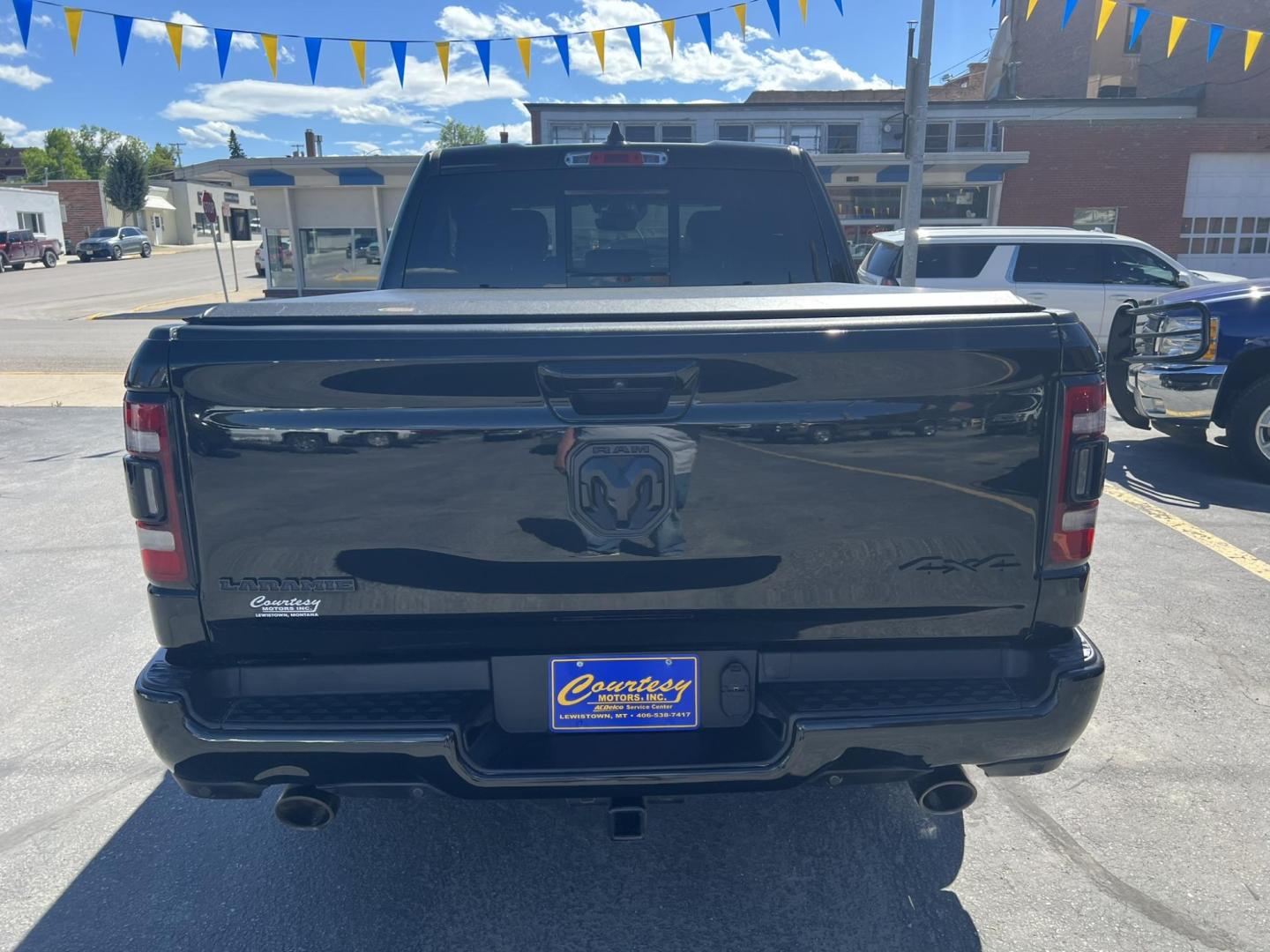 2021 Black /Black RAM 1500 Laramie Crew Cab SWB 4WD (1C6SRFJT8MN) with an 5.7L V8 OHV 16V engine, 8A transmission, located at 116 5th Avenue South, Lewistown, MT, 59457, 47.063877, -109.427879 - Photo#2