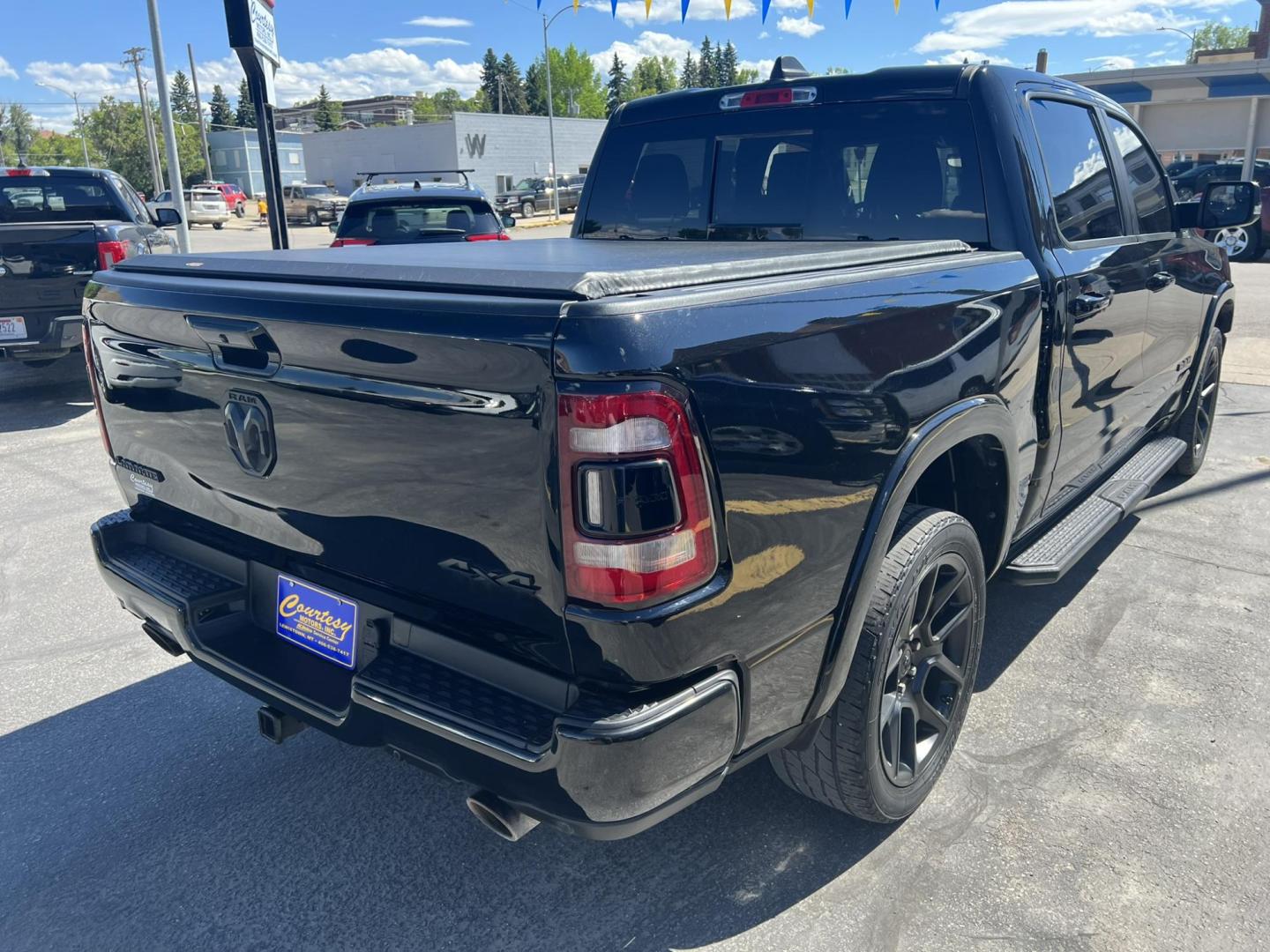 2021 Black /Black RAM 1500 Laramie Crew Cab SWB 4WD (1C6SRFJT8MN) with an 5.7L V8 OHV 16V engine, 8A transmission, located at 116 5th Avenue South, Lewistown, MT, 59457, 47.063877, -109.427879 - Photo#4