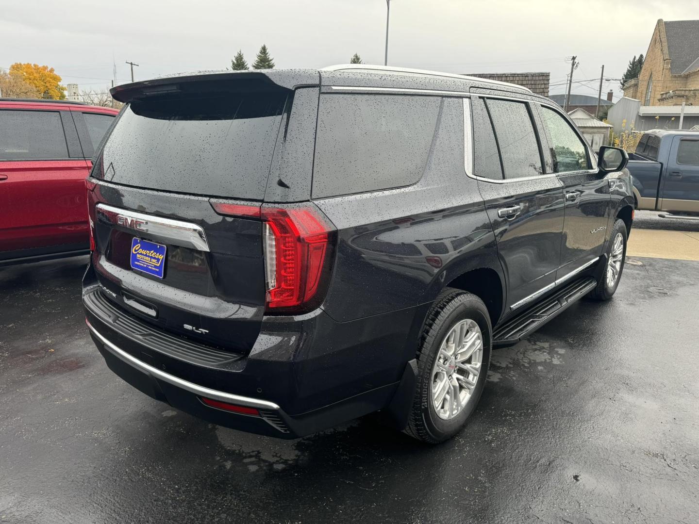 2023 Titanium /Black GMC Yukon SLT 4WD (1GKS2BKD0PR) with an 5.3L V8 OHV 16V FFV engine, 10A transmission, located at 116 5th Avenue South, Lewistown, MT, 59457, 47.063877, -109.427879 - Photo#2