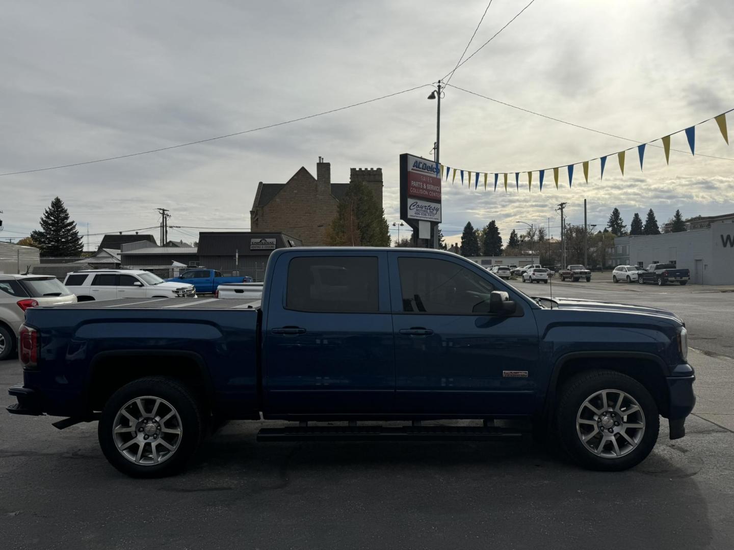 2017 Blue /Charcoal GMC Sierra 1500 SLT Crew Cab Short Box 4WD (3GTU2NEC0HG) with an 5.3L V8 OHV 16V engine, 6A transmission, located at 116 5th Avenue South, Lewistown, MT, 59457, 47.063877, -109.427879 - 2017 GMC Sierra 1500 Crew Cab All Terrain 4WD. This truck is equipped with a powerful 5.3L V8 engine, providing excellent towing capacity and smooth performance. The All Terrain package includes an upgraded suspension for off-road capabilities, and the four-wheel drive system ensures superior handli - Photo#1