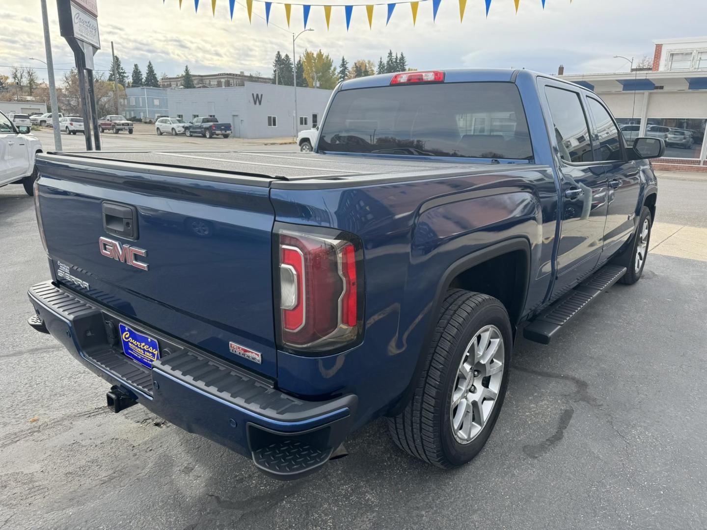 2017 Blue /Charcoal GMC Sierra 1500 SLT Crew Cab Short Box 4WD (3GTU2NEC0HG) with an 5.3L V8 OHV 16V engine, 6A transmission, located at 116 5th Avenue South, Lewistown, MT, 59457, 47.063877, -109.427879 - 2017 GMC Sierra 1500 Crew Cab All Terrain 4WD. This truck is equipped with a powerful 5.3L V8 engine, providing excellent towing capacity and smooth performance. The All Terrain package includes an upgraded suspension for off-road capabilities, and the four-wheel drive system ensures superior handli - Photo#2