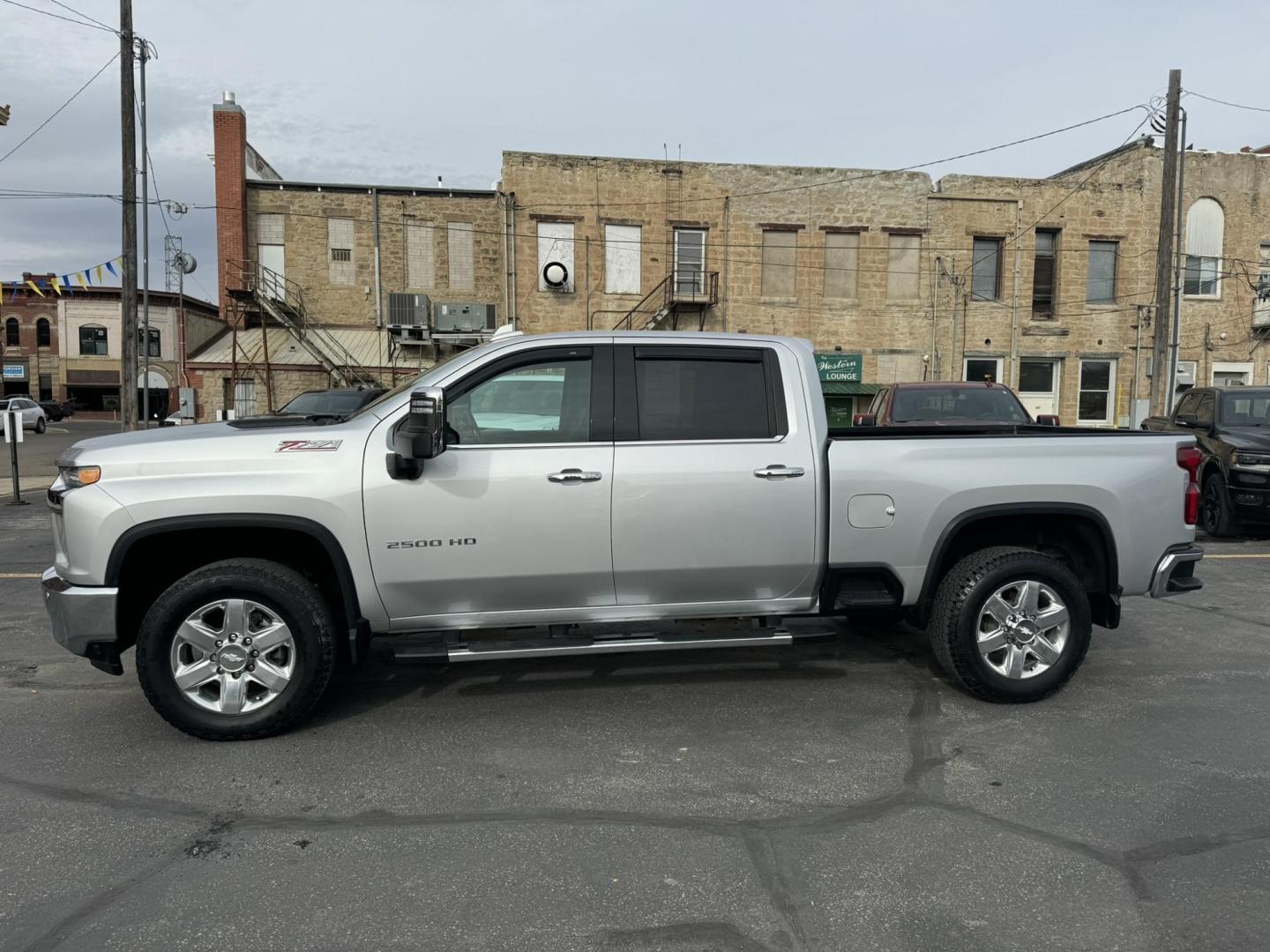 2020 silver /Black Chevrolet Silverado 2500HD LTZ Crew Cab Short Box 4WD (1GC4YPE75LF) with an 6.6L V8 OHV 16V engine, 6A transmission, located at 116 5th Avenue South, Lewistown, MT, 59457, 47.063877, -109.427879 - 2020 Chevrolet Silverado 2500HD Crew Cab LTZ 4WD with a powerful 6.6L gas engine. This heavy-duty truck offers exceptional towing and hauling capabilities, making it perfect for both work and play. The LTZ trim provides a premium experience with a refined interior that includes leather-appointed sea - Photo#4