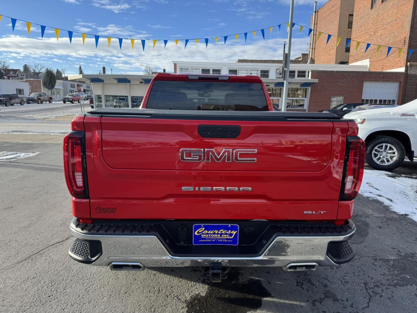 2021 Red /Grey GMC Sierra 1500 SLT Crew Cab Standard Box 4WD (3GTU9DEL9MG) with an 6.2L V8 OHV 16V engine, 6A transmission, located at 116 5th Avenue South, Lewistown, MT, 59457, 47.063877, -109.427879 - Discover the perfect blend of power, luxury, and capability with this 2021 GMC Sierra 1500 Crew Cab SLT 4WD, equipped with a robust 6.2L gas engine. Designed to elevate your driving experience, this truck offers exceptional performance, premium features, and the versatility to tackle any challenge. - Photo#2