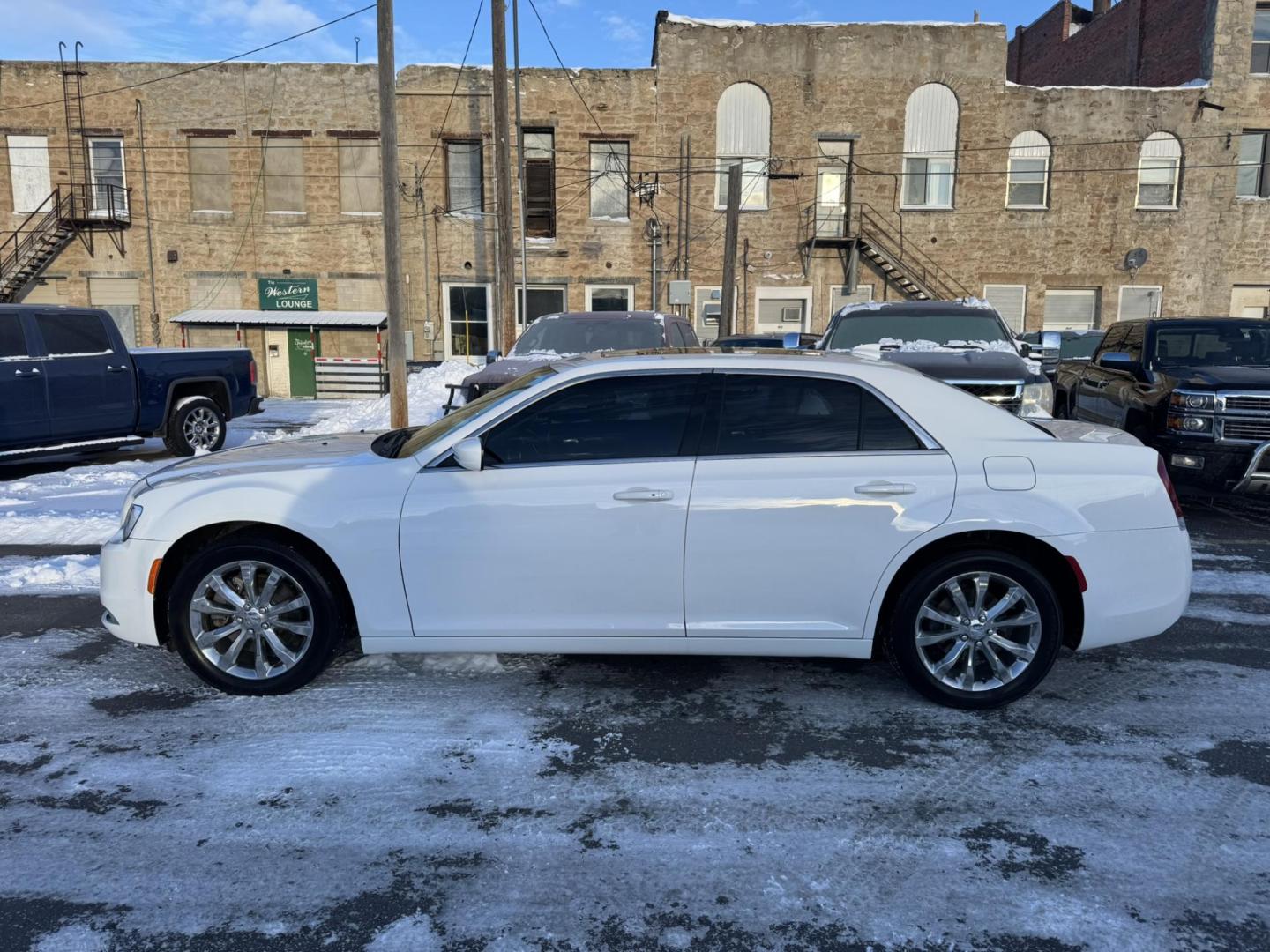 2016 WHITE /Black Chrysler 300 Limited AWD (2C3CCARG7GH) with an 3.6L V6 SOHC 24V engine, 8A transmission, located at 116 5th Avenue South, Lewistown, MT, 59457, 47.063877, -109.427879 - For sale: a stunning 2016 Chrysler 300 Limited AWD Anniversary Edition, a perfect blend of luxury, performance, and all-weather capability. This special edition sedan stands out with its bold design, premium finishes, and advanced features. The all-wheel-drive system provides confidence on any road, - Photo#4